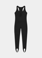 A black sleeveless one-piece jumpsuit with a racerback design, front lace-up detail, and integrated leg warmers with cutout details at the toes, shown against a light gray background.