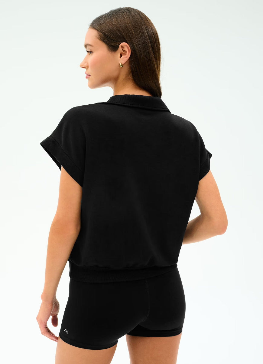 Woman wearing a black outfit on a white background