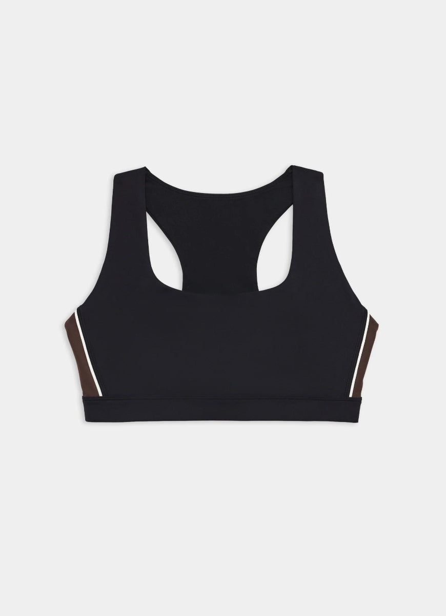 Black sports bra with white accents on a light gray background