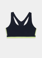 A dark navy blue racerback sports bra with neon yellow-green trim along the underbust and bottom hem, displayed flat against a light gray background.
