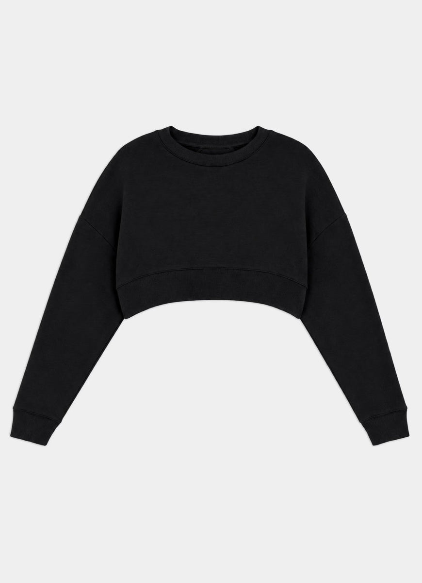 A black cropped long-sleeve sweatshirt with a wide crew neck and ribbed cuffs, displayed against a light gray background.