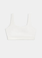 White sleeveless top on a light gray background