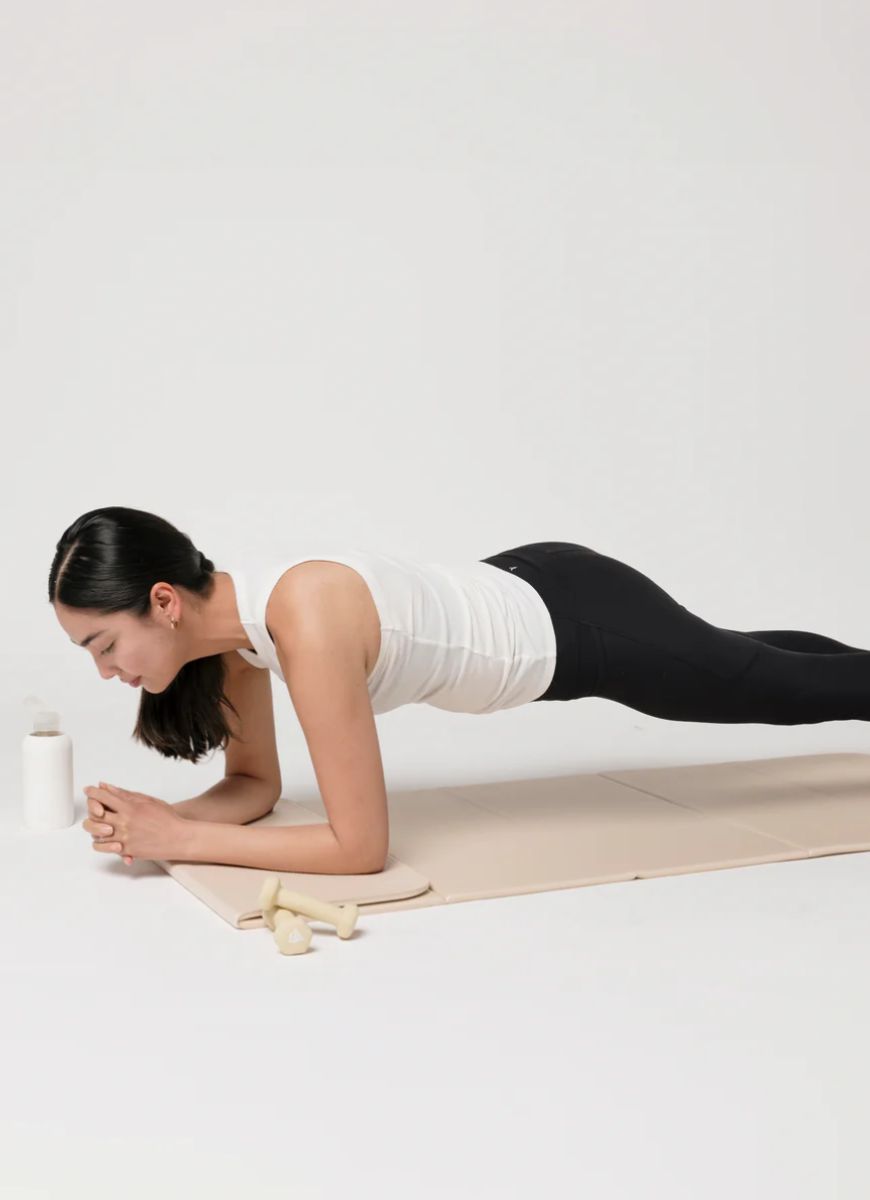 stakt The Stakt 2-in-1 Yoga Mat & Block in Dune Model Shown in a Plank Position