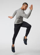 vuori Men's Sunday Performance Jogger in Black Model Shown in a Running Stance