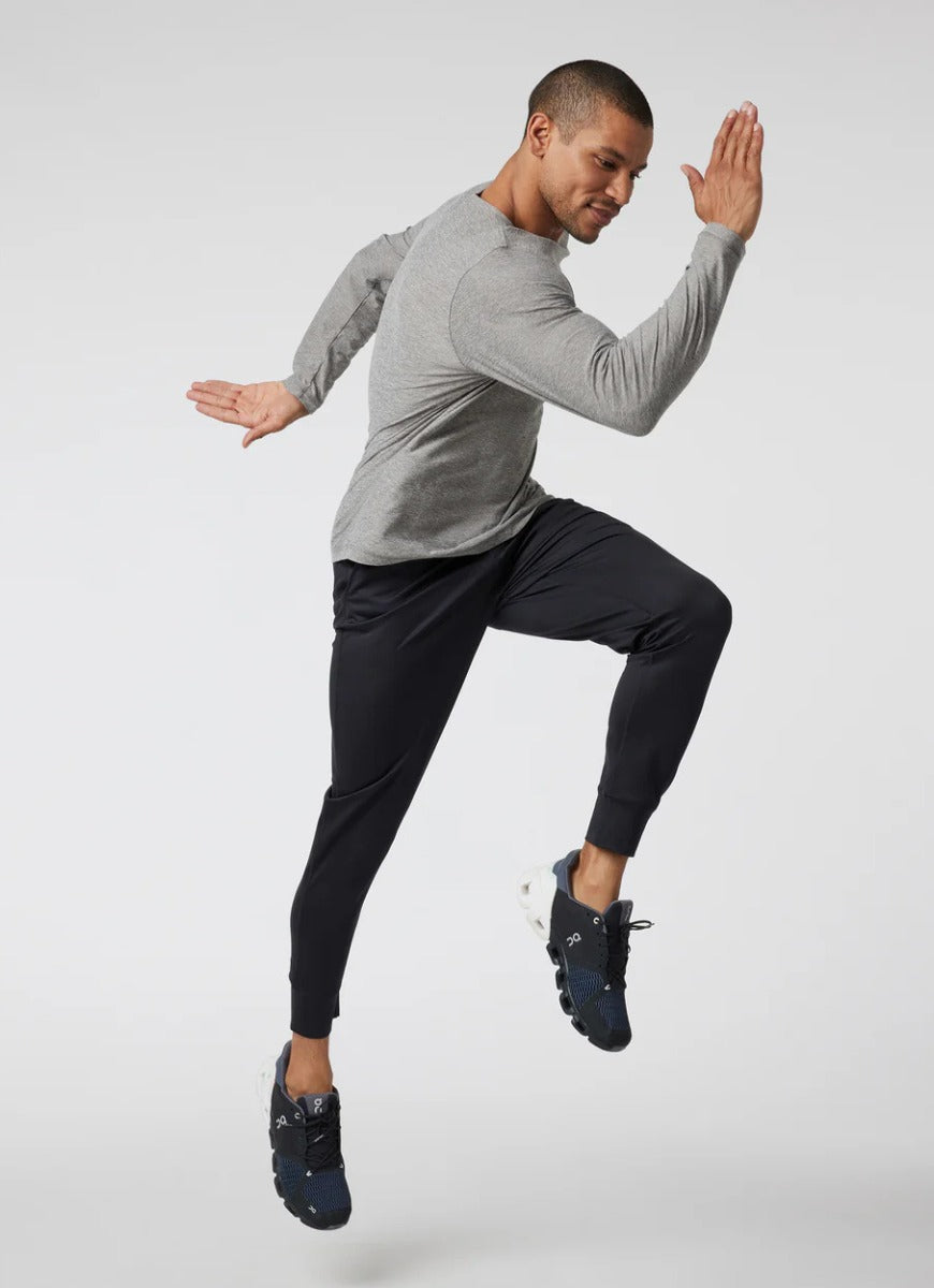 vuori Men's Sunday Performance Jogger in Black Model Shown in a Running Stance