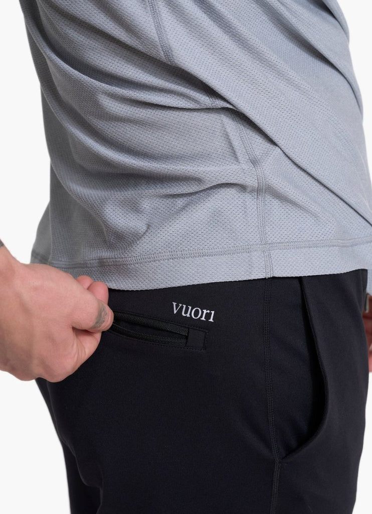vuori Men's Sunday Performance Jogger in Black Close Up Side View of Logo