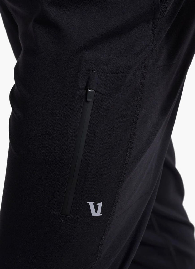 vuori Men's Sunday Performance Jogger in Black Close of Side Thigh View of Logo