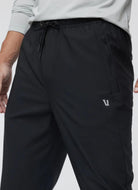 Vuori Men's Train Tech Pant in Black Close Up Front View