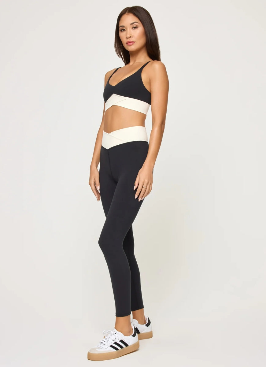 LSPACE Unmatched Sports Bra in Black/Cream Full Length Side View