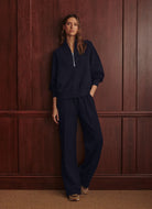 Varley Davidson Sweatshirt in Blue Nights Full Length Front View With Hand in Pocket