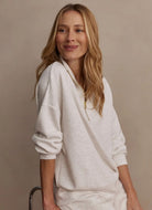 Varley Hawley Half Zip Sweat in Ivory Marl Model Sitting Down