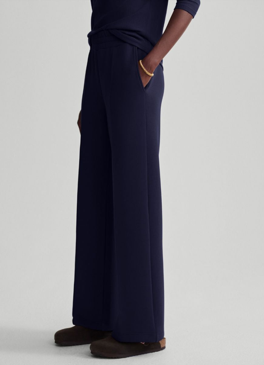 Varley The Wide Leg Pant 30” in Blue Nights Side View With Hand in Pocket