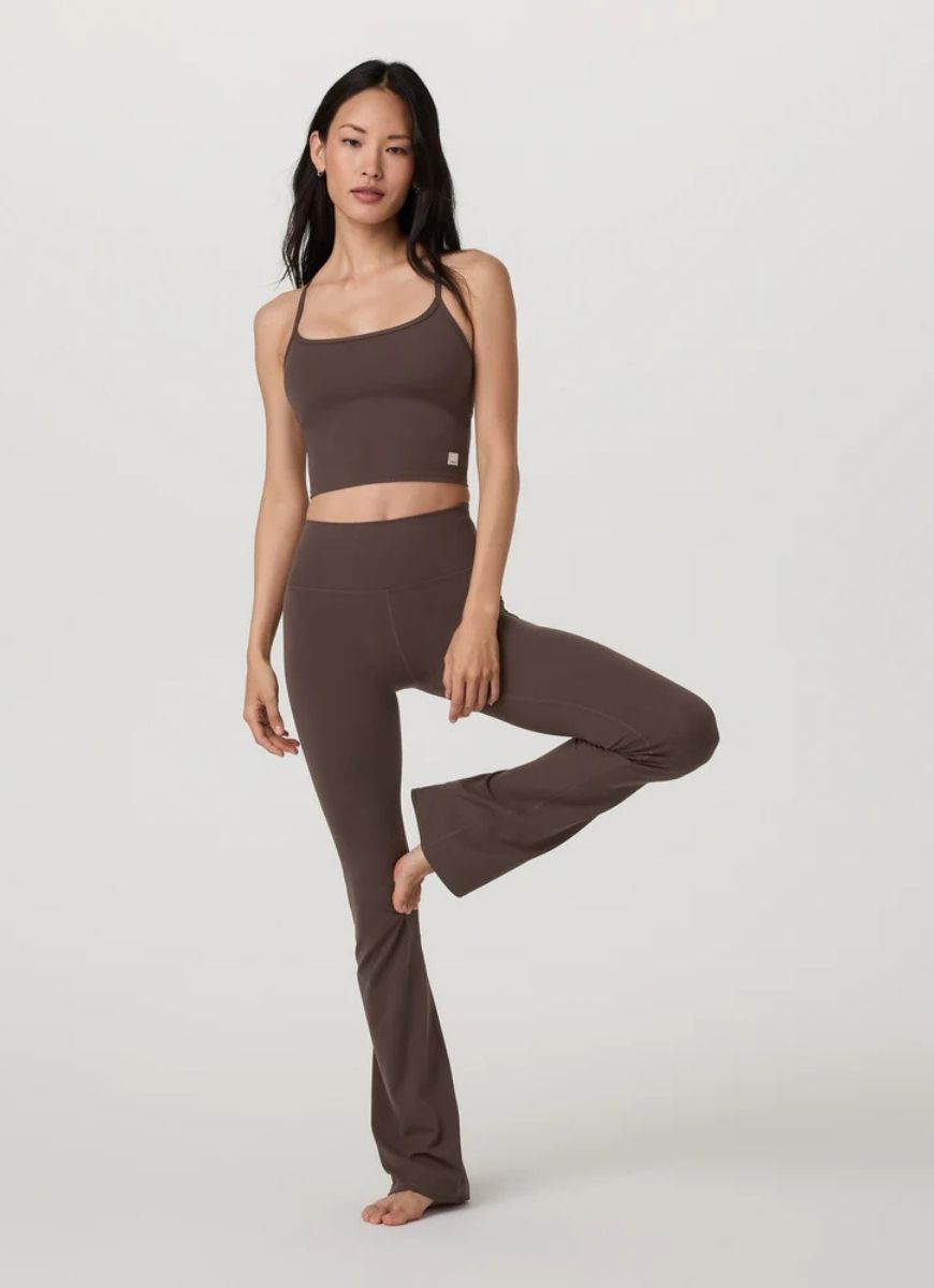 Vuori AllTheFeels Slim Flare in Java Front View With Model in a Yoga Pose