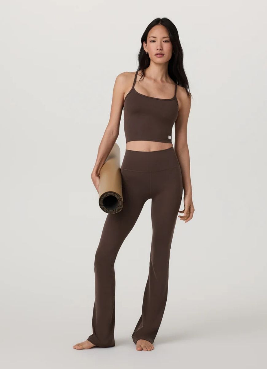 Vuori AllTheFeels Tank Top 2.0 in Java Front View With Model Holding a Yoga Mat
