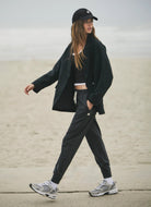 Vuori Performance Jogger in Charcoal Heather Model Showing Walking