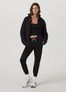 Vuori Women's Performance Jogger Long in Black Heather Full Length Front View