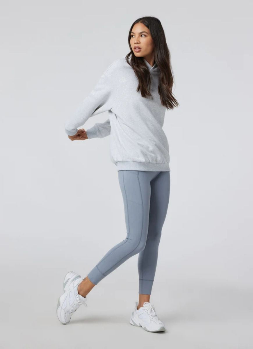 Vuori Restore Oversized Hoodie in Pale Grey Heather Full Length Angled Front and Side View