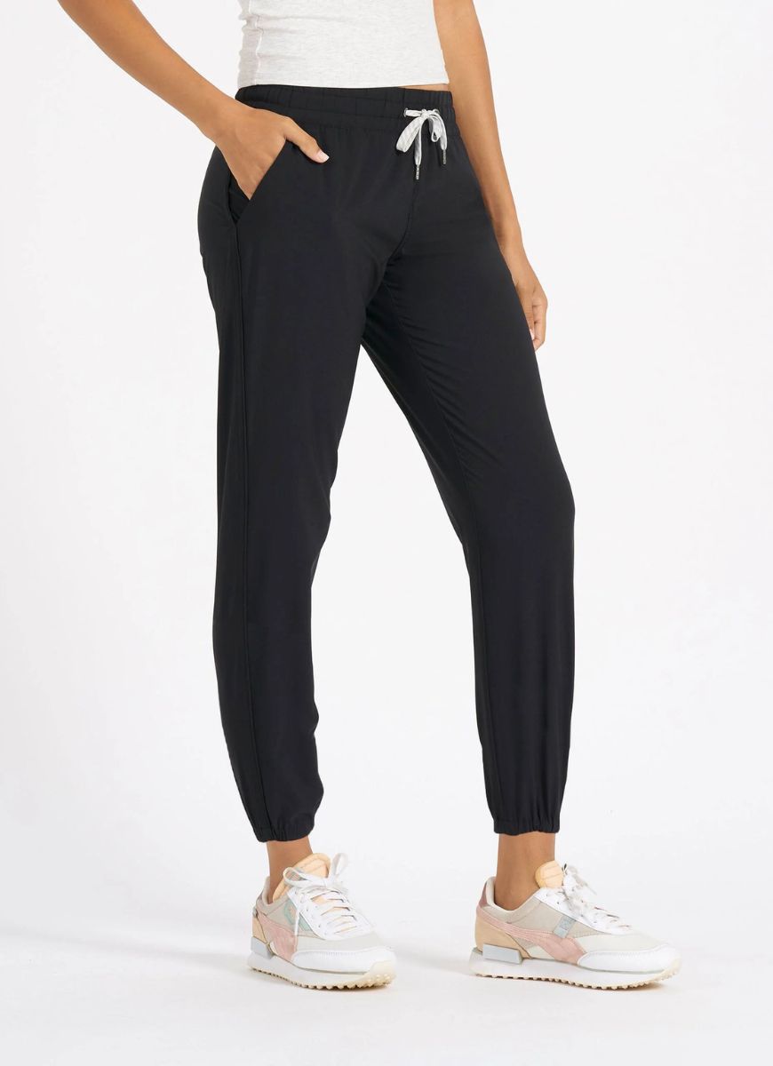 Vuori Women's Weekend Jogger in Black Side View With Hand in Pocket
