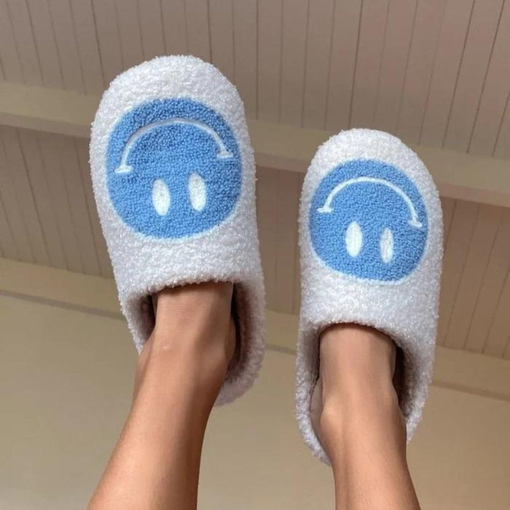 Women's Blue Smiley Face Slippers Modeled on Feet