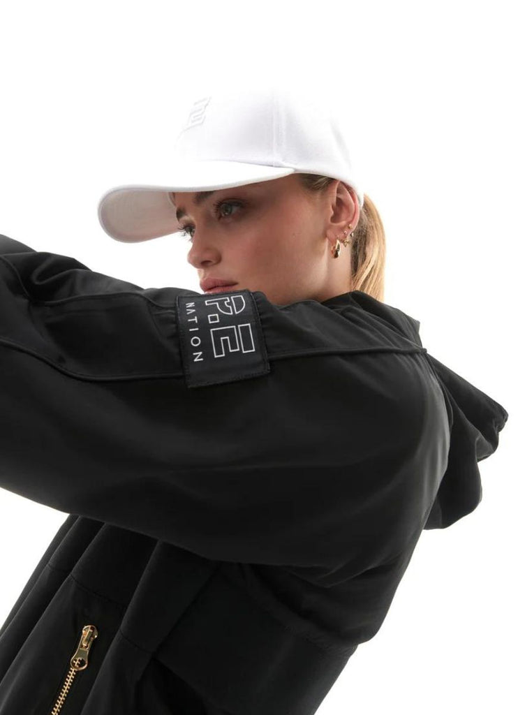 P.E Nation Endurance Man Down Women's Jacket in Black Close up Side View of Logo on Upper Sleeve