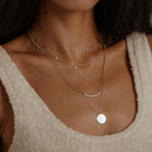 bluboho Everyday Little Crescent Moon Necklace in 14K Gold Shown on Models Neck
