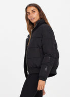 The Upside Nareli Insulated Women's Puffer Jacket in Black Side View