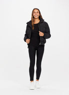 The Upside Nareli Insulated Women's Puffer Jacket in Black Full Model Front View