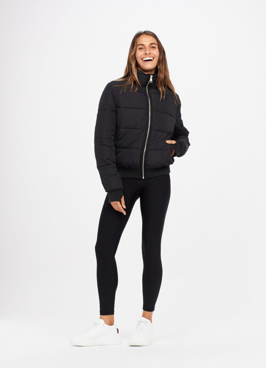 The Upside Nareli Insulated Women's Puffer Jacket in Black Full Model Front View Zipped Up