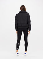 The Upside Nareli Insulated Women's Puffer Jacket in Black Full Model Back View