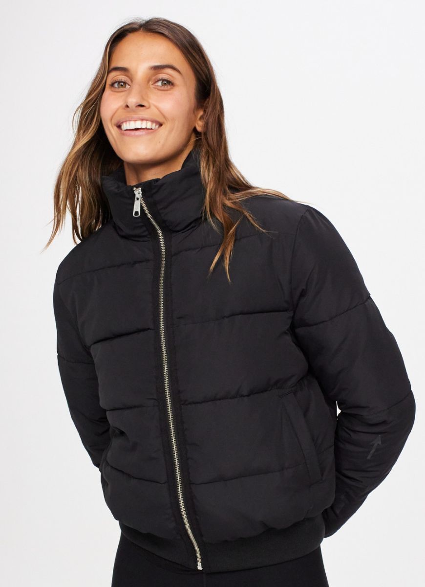 The Upside Nareli Insulated Women's Puffer Jacket in Black Close Up View Fully Zipped Up
