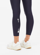 The Upside Matte Tech Midi Women's Pant in Indigo Close Up View of the Logo on the Back of the Leg