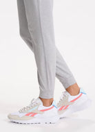 Vuori Women's Performance Jogger Long in Heather Grey Close Up Side View Thigh Down